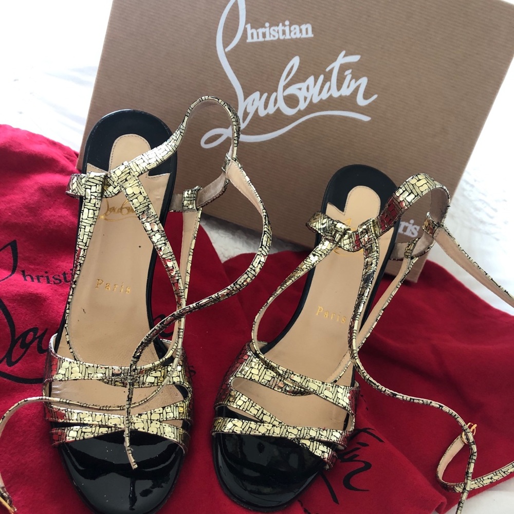 Used Christian Louboutin sandal in gold and black!
